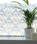 Self-Adhesive Privacy Glass Window Film In Minster/Iris Pattern, 17 X 78 Inch Roll on window with plant and candles