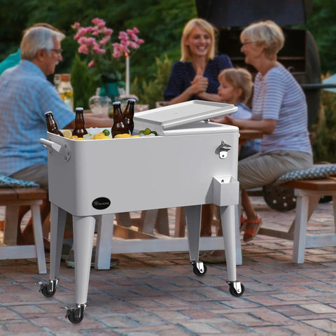 80 Quart Rolling Cooler Cart With Bottle Opener And Drainage On Wheels Portable Patio Beverage Cart For Pool Deck Outdoor Parties And Cookouts White Great For Summer with drinks on a patio.