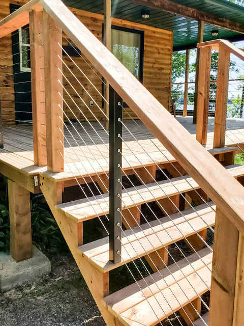 Wooden deck railing with One Eighth Inch Stainless Steel Wire Rope Kit 400 Feet Of Aircraft Cable and M5 Turnbuckles installed