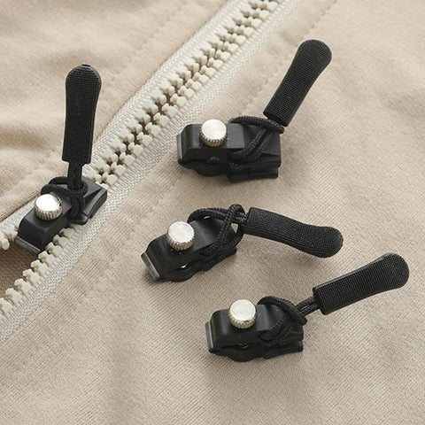 Zipper Repair Kit Puller Replacement Tool Three Piece Set With Easy Grip Design on a beige fabric with black pullers