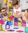 Family playing with Magnetic Tiles Building Blocks Set For Kids 110 Pieces STEM Construction Toy With Dinosaur Figures