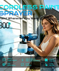 Ditch The Cords With This Hardworking Cordless Paint Sprayer Boasting A Bright LED Lamp, shown in use painting a house.