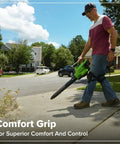 Person using Three In One Cordless Leaf Blower Vacuum Mulcher With Dual 48V Batteries for quick sidewalk cleanup.