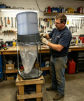 Man assembling Heavy Duty Dust Collector Filter Cartridge With Outer Mesh 12.6 Inch Opening And 23.62 Inch Height for machinery.