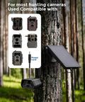 Solar Panel Kit For Trail Cams With 6000mAh Battery And 12V Output IP66 Waterproof mounted on tree in forest
