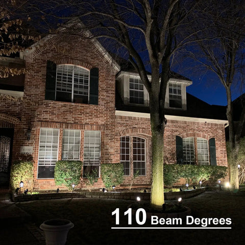 Low Voltage Landscape Well Lights 4 Pack 4W LED Pathway Lighting illuminating house front with warm white 200 lumens at night