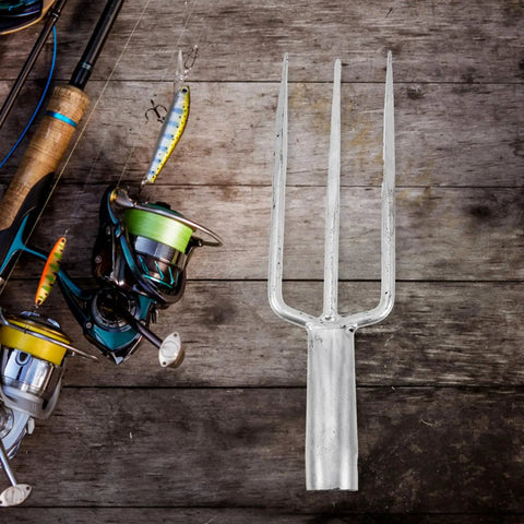 Three-Prong Fish Fork Beefed-Up Heavy Duty Steel Garden Tool For Fishing And Harvesting Ergonomic Handle next to fishing rods