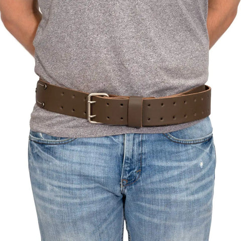 Person wearing 2 Inch Wide Full Grain Leather Tool Belt For Pros 100 Percent Cowhide With Double Tongue Steel Roller Buckle Heavy Duty Belt