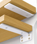 Kickass Heavy Duty Floating Shelf Brackets 10 Inch 6 Pack supporting a wooden shelf with white iron supports, showcasing clean installation.