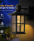 Porch Lights With Outlet GFCI Motion Sensor Outdoor Wall Light Black Waterproof Dusk To Dawn Lantern shown in rain