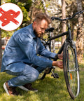 Man adjusting wheel near MTB bike with 4 Piece Bicycle Brake Spacer Set For Disc Brakes And Hydraulic Systems shown in insert.