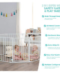 Two children playing inside Ultra Wide Baby Gate And Play Yard For Kid And Pet Friendly Homes Nearly 16 Feet Long Two In One Convertible Safety Barrier Hardware Mounted For Toddlers And Pets Tested And Trusted For 30 Years American Designed And Owned White in living room