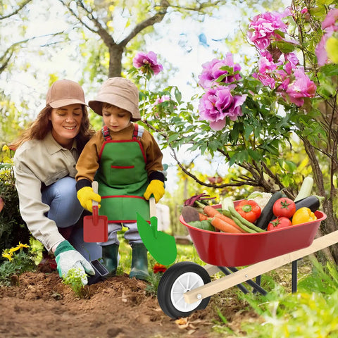 Kid Friendly Gardening Wheelbarrow Set With Real Wheelbarrow, Wooden Tools, Apron, Gloves in garden setting with child and adult
