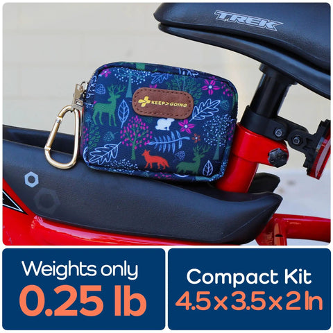 Tiny But Mighty Travel First Aid Kit For Kids, 60-Piece Mini Set For Purse, Diaper Bag, Or Backpack, attached to a bike.