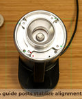 Top Shelf Single Dose Coffee Grinder Equipped With 83Mm Red Titanium Flat Burrs And Integrated Plasma Ionizer Chute For Zero Static Clumps Ideal For Home Brew Crews Chasing Consistent Pulls Without Any Headache In Classic Black showing 4 guide posts for stabilizing alignment.