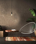 One Light Pendant With Matte Black Finish, Black Woven Fabric Cord, E26 Base Socket, Adjustable Hanging Length in cozy room