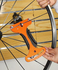 Bike Spoke Tension Meter And Spoke Wrench Kit For Road And Mountain Bikes, Aluminum Alloy Wheel Tool in use on bike wheel
