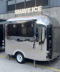 Built Different Stainless Steel Food Truck With Fully Loaded Commercial Kitchen Sleek Custom Mobile Concession Trailer For Catering Events And Serious Street Vendor Hustles shiny exterior view with open serving window.