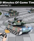 1:18 Scale RC Tank With 2.4G Radio, M1A2 Style Military Battle Vehicle, Metal Alloy Build on gray checkered pavement with remote control
