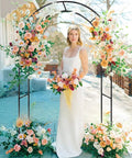 Bride posing under a Sturdy Garden Pergola Arch With No Fuss Base For Climbing Plants Four Point Six Feet Wide And Seven Point Nine Feet Tall
