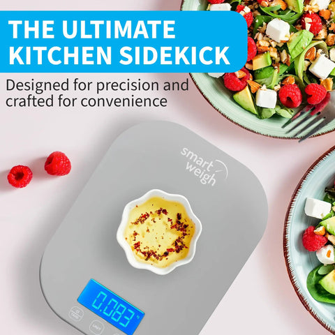 Gray digital kitchen scale for cooking, 5 kg and 11 lb capacity, with a bowl and salad, perfect for meal prep and baking