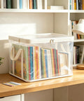 Set Of Three Thick Clear Plastic Storage Bins With Hinged Lids Heavy Duty Stackable Organizer Boxes For Bedroom Closet And Travel Gear Roomy Sturdy Containers That Kick The Clutter Out And Keep Your Space Slick with children's books inside.