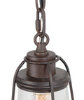 Close-up of Farmhouse Pendant Lighting Mini Rustic Hanging Light in bronze finish with seeded glass shade and chain detail.
