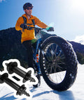 Cyclist on snow with Beefy Fat Tire Mountain Bike Hub Set for 26x4.0 Snow Biking Front 135mm Rear 190mm Through Axle