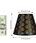 Black lampshade with geometric cut-out pattern next to a dollar bill for size reference, 5x9x7 inches dimensions.