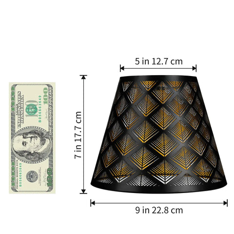 Black lampshade with geometric cut-out pattern next to a dollar bill for size reference, 5x9x7 inches dimensions.
