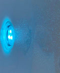 Close-up of hydro microbubble jets in a 30X52 wheelchair accessible transfer walk in tub featuring blue lighting.