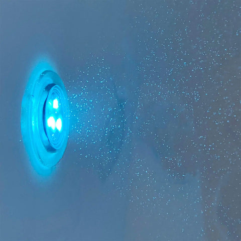 Close-up of hydro microbubble jets in a 30X52 wheelchair accessible transfer walk in tub featuring blue lighting.