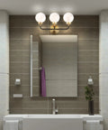 Bathroom with 22 Inch Brass Gold Black White 3 Light LED Wall Sconce Vanity Lighting With Clear Glass Globe Shades for Modern Vibe