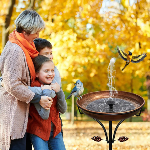 Family with children near a vintage outdoor metal bird bath with free standing stake and detachable feeder bowl in antique bronze finish.