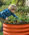 Child in garden with Open Base Galvanized Raised Garden Bed For Outdoor Use 4 By 2 By 1 Ft Planter For Veggies Flowers And Herbs Orange Metal Garden Box