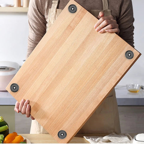 Person holding cutting board with Eight Pack Non Slip Rubber Feet Bumpers Kit With Screws And Stainless Washers