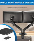 Built Tough Steel Monitor Mount Reinforcement Plate with EVA pads, mounted for dual monitor setups on a desk.