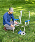Revamp Your Worn Out Lawn Chairs With This Heavy Duty Replacement Webbing Kit Featuring UV Resistant Polypropylene Straps For Nailed Backyard Fixes That Stay Tight Through Every Season Change, man fixing lawn chair with webbing.
