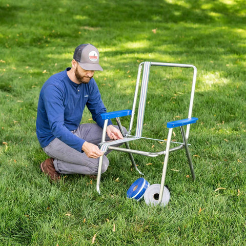Revamp Your Worn Out Lawn Chairs With This Heavy Duty Replacement Webbing Kit Featuring UV Resistant Polypropylene Straps For Nailed Backyard Fixes That Stay Tight Through Every Season Change, man fixing lawn chair with webbing.