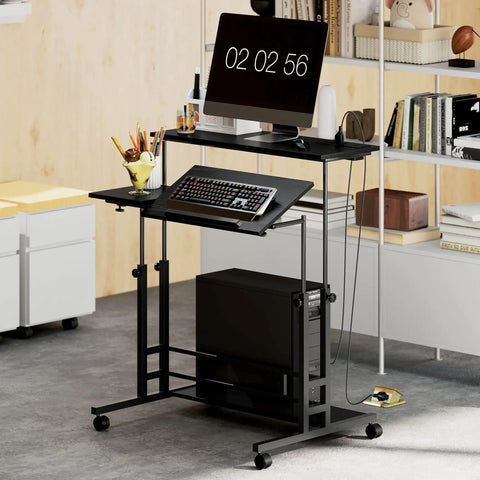 Electric adjustable standing desk featuring a built in power hub with dual USB ports and a rolling storage shelf in black finish.