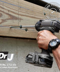 Person using a power tool to drive a 5/16 Inch By 5 Inch Exterior Washer Head Structural Wood Lag Screw into wood.