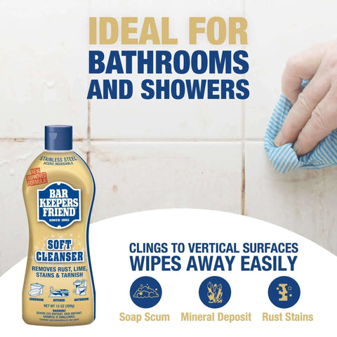 Soft Cleanser Liquid 2 Pack 13 Oz Bottles Multipurpose Cleaner and Rust Stain Remover for Stainless Steel Porcelain Ceramic Tile and More Tackle Grime Fast in Kitchen and Bath shown with a hand wiping a tiled wall.