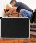 Portable Aluminum Toolbox With Lock Sleek Rigid Case For Small Tools Hardware Gear, sturdy black organizer near worker.