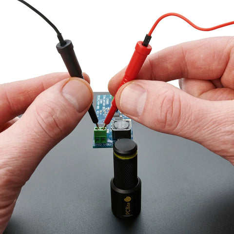 Two SQ200 And Four SQ10 Handsfree Probes Kit For PCB Testing And Soldering in use on circuit board with precision tips