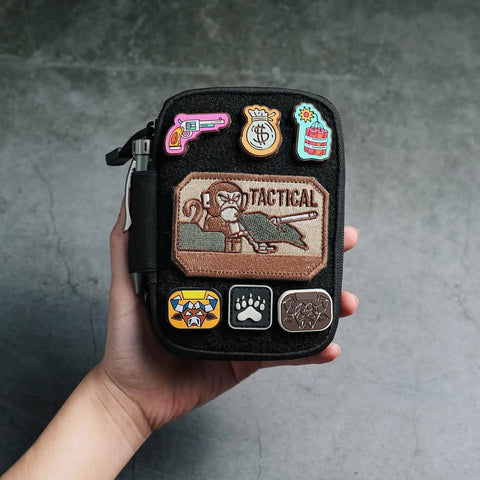 Hand holding EDC Pocket Organizer Pouch With DIY Patches Area Nylon Utility Pocket For Everyday Carry Dope Small Tool Pouch