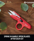 Hydroponic Finger Micro Snips With Precision Micro Tip Blades on wooden surface, surrounded by green leaves