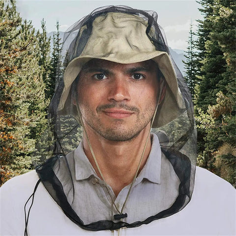 Man wearing Shielding Bugproof Mesh Head Net And Protective Headwear For Outdoorsy Folks Who Love Fishing Camping And Hiking Lakeside Adventures Keeps Bugs Out And Breathes Easy in forest
