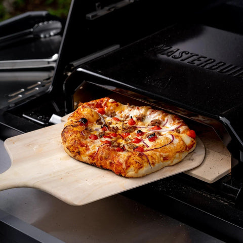 Gravity Series Outdoor Pizza Oven Accessory Insert With Ceramic Stone And Stainless Interior, Porcelain-Coated Exterior In Black Cooking Pizza