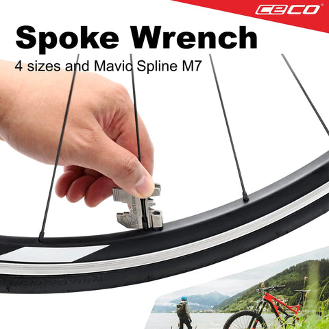 Close-up of hand using Pro Grade 20 Function Bike Tool with Chain Breaker on bicycle wheel spoke