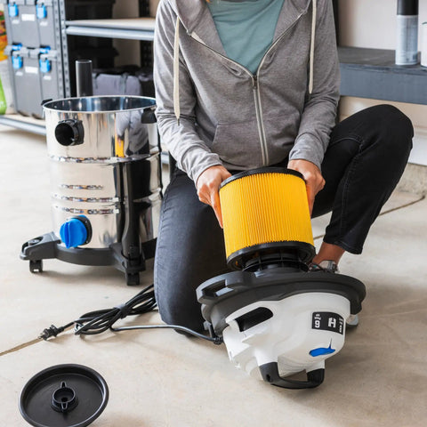 Person installing 2 Pack Replacement Filter For Hart Wet Dry Vacuums 5 To 20 Gallon, cartridge filter in vacuum cleaner